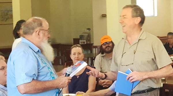 A02 Roaming Catholic Launch 02 Fr Roger presenting copies to Peter Macinante of Chevalier Press